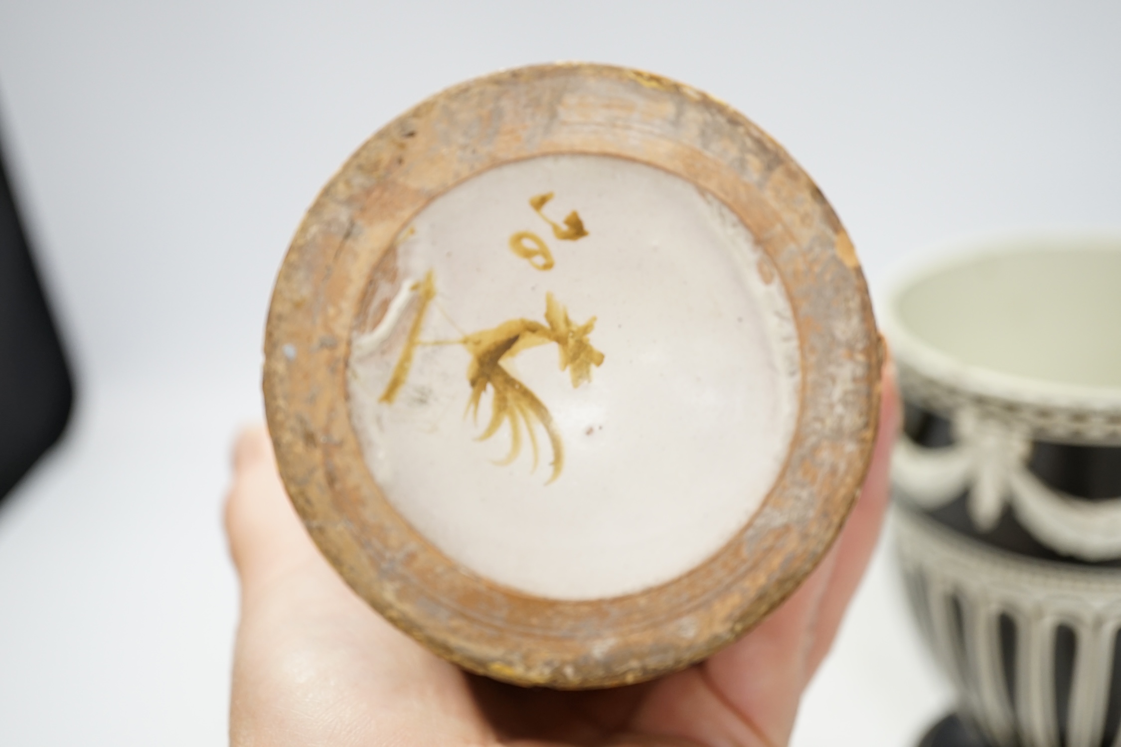 A Wedgwood pot and faience glazed jug and a Cantagalli maiolica pearl glazed jug, 26cm. Condition - poor, losses to upper rim of Cantagalli jug and restoration to base of Wedgwood